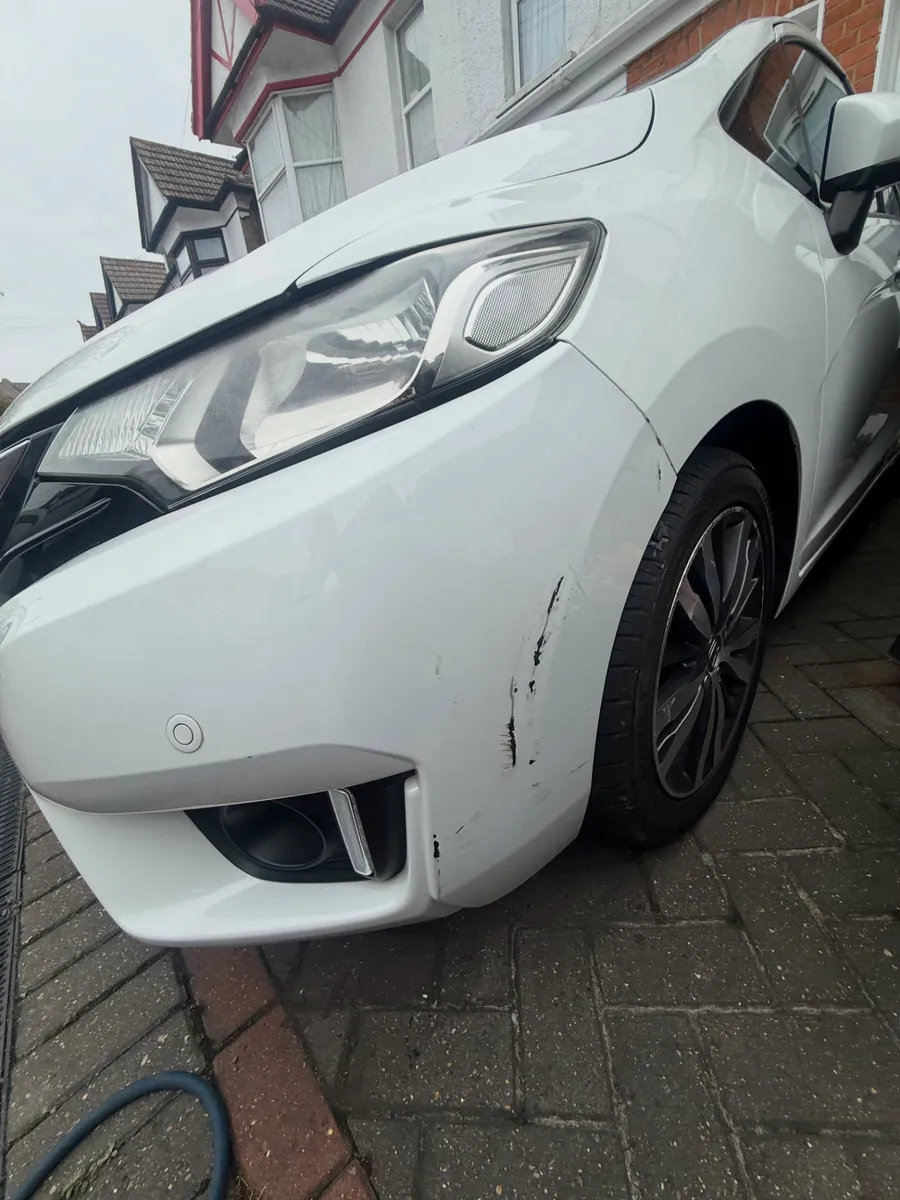 Before: white hatchback front bumper